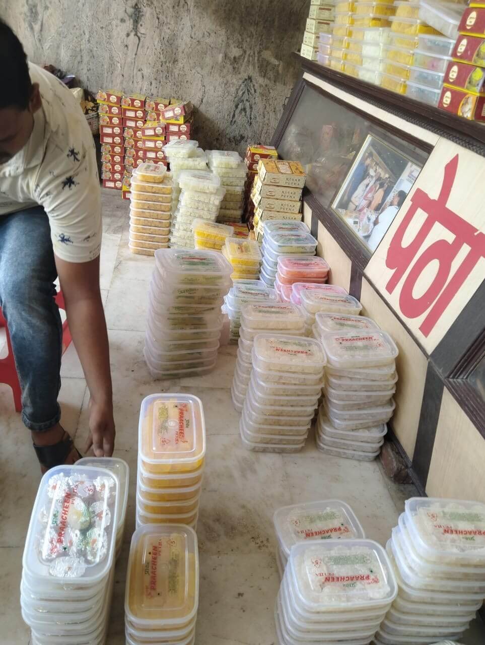 Packaged varieties of Agra petha stacked inside a shop