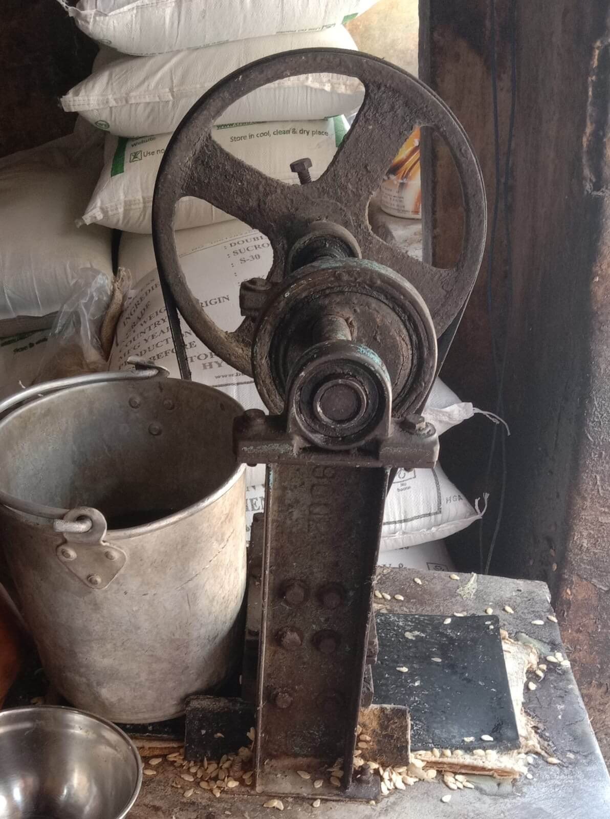 Old belt-driven machinery inside a petha workshop